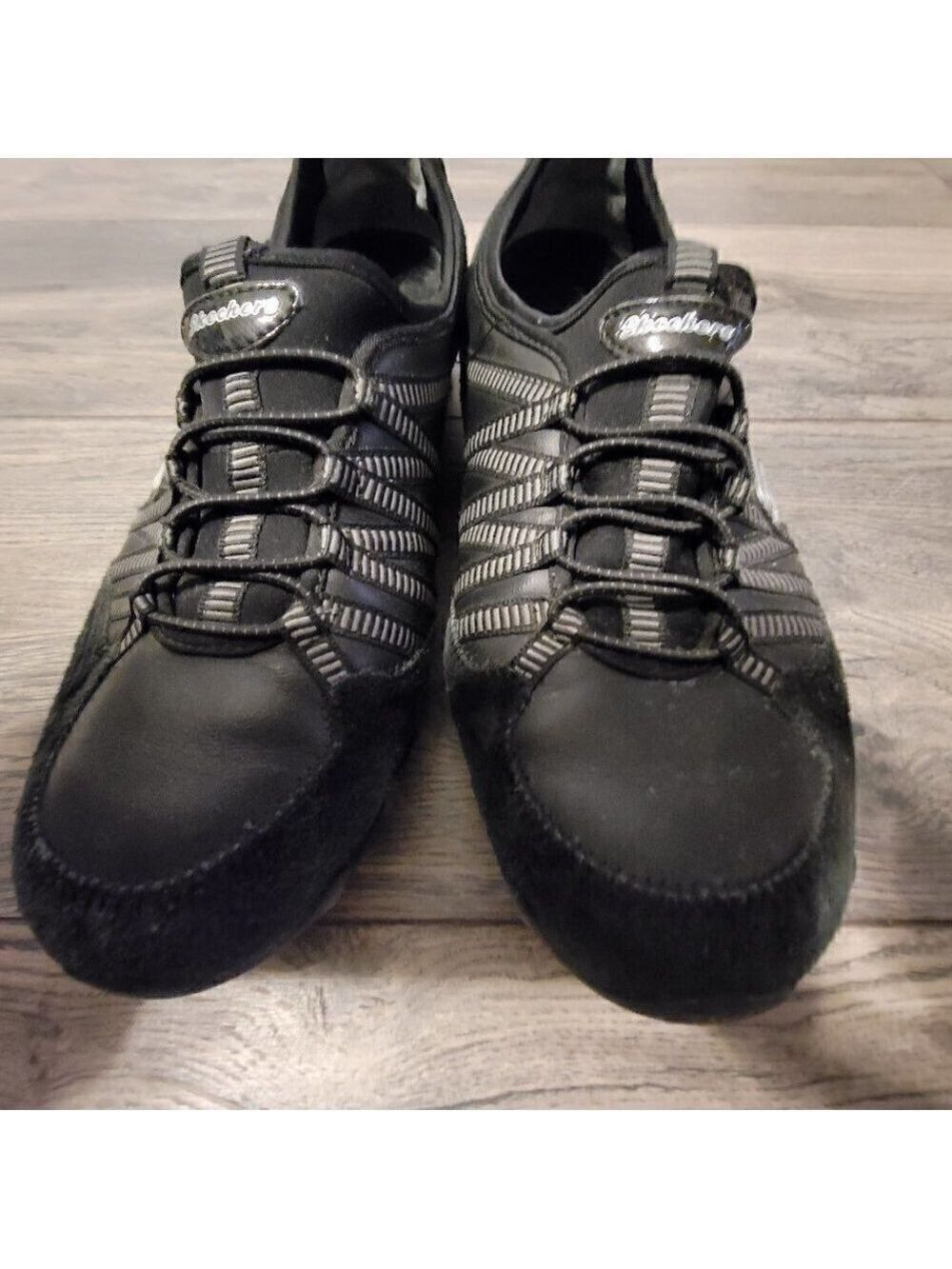 Skecher's black suede and leather sneaker.  Super comfortable.  Size 9